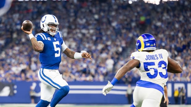 Oct 1, 2023; Indianapolis, Indiana, USA; Indianapolis Colts quarterback Anthony Richardson (5) passes the ball while Los Angeles Rams linebacker Ernest Jones (53) defends in the second half at Lucas Oil Stadium. Mandatory Credit: Trevor Ruszkowski-USA TODAY Sports